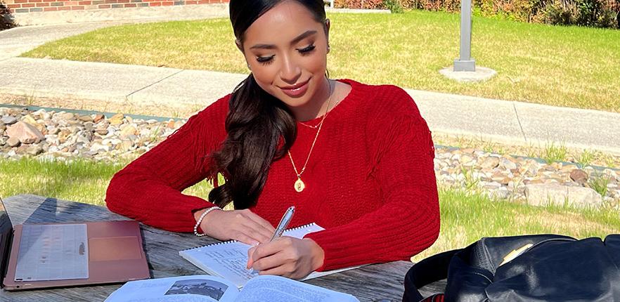 Student studying on campus